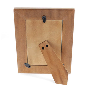 Back view of wooden photo frame with hinged tabletop stand and wall hook.