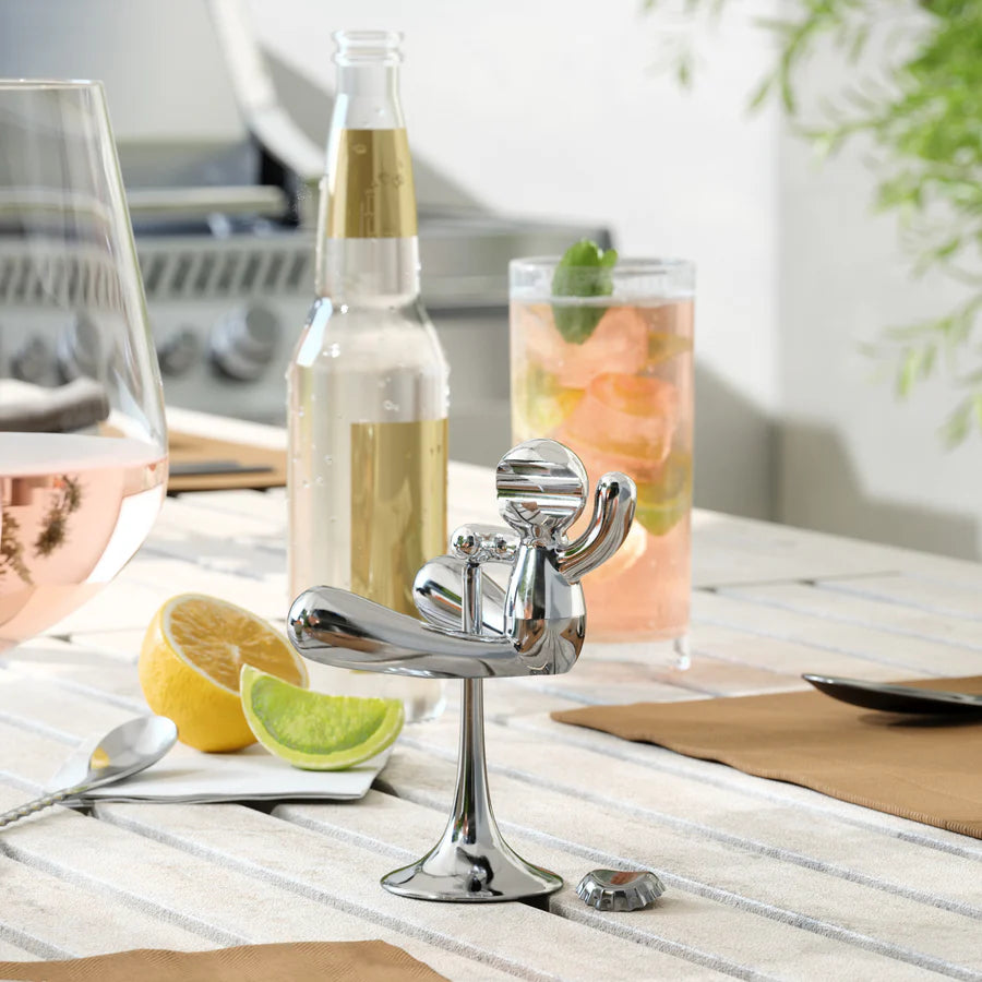 Umbra Rodeo Buddy bottle opener chrome on outdoor table with drinks