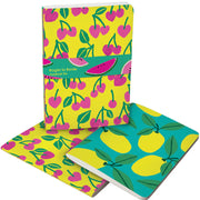 Set of two Roger la Borde Cute Fruit A5 Notebooks displayed open and stacked, with illustrated cherry and lemon covers, colourful spine stitching, and FSC-certified paper.