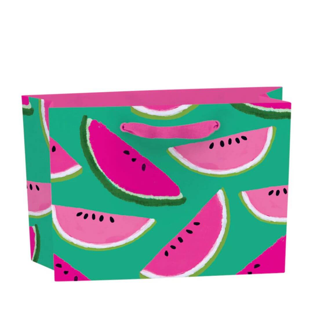 Small recyclable watermelon gift bag featuring Anne Bentley’s pink and green fruit illustrations on a bright teal background, with grosgrain ribbon handles and matching tag.
