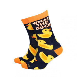 Rubber Ducks Men’s Bamboo Socks featuring a playful yellow duck pattern with ‘What The Duck’ text on a navy background, accented with bright orange heels and cuffs.