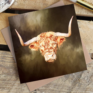 Rusty Rebel Highland Cow Blank Greetings Card displayed on a rustic wooden surface.