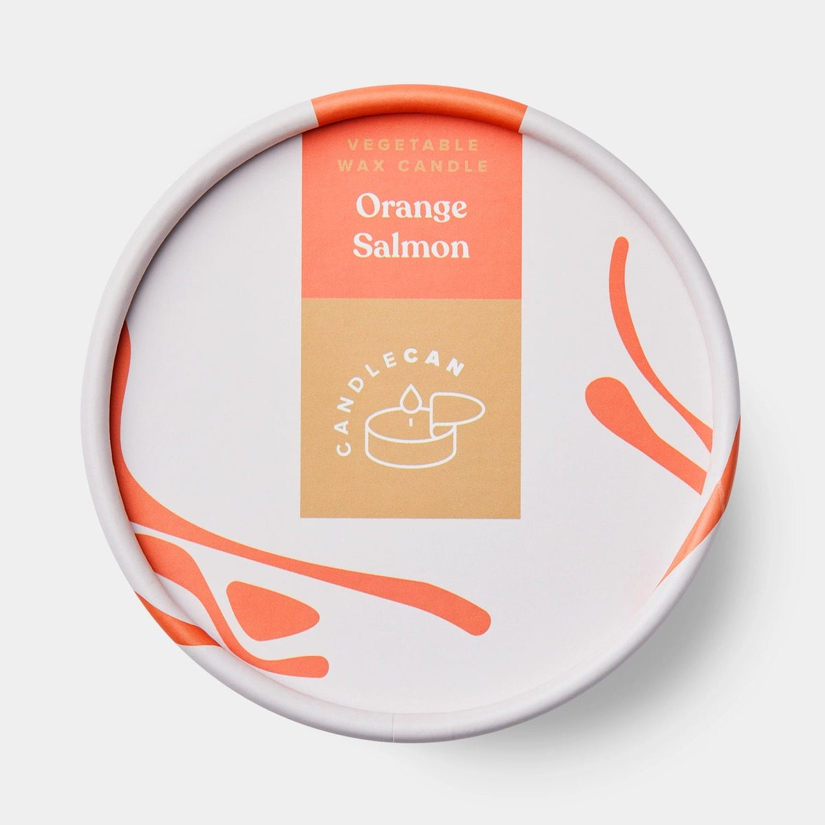 Flat-lay of the Orange Salmon CandleCan lid featuring modern white and orange packaging with “Vegetable Wax Candle – Orange Salmon” label.