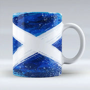 Ceramic mug with bold blue and white Scottish Saltire in painted brushstroke style.