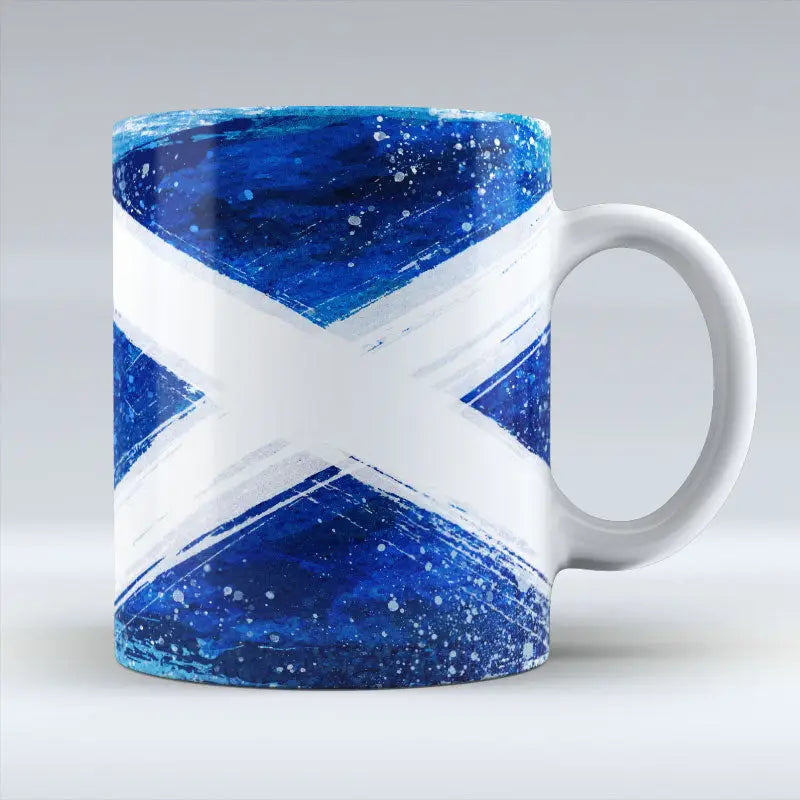 Ceramic mug with bold blue and white Scottish Saltire in painted brushstroke style.