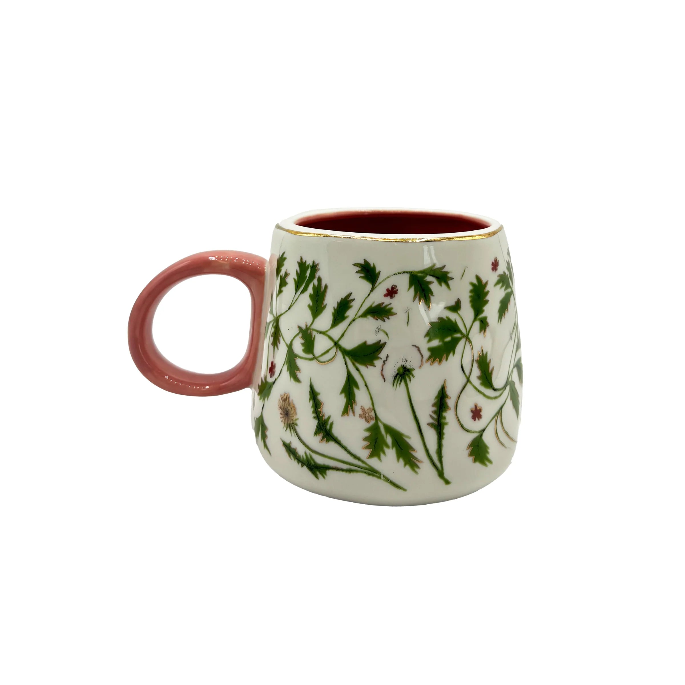 Floral ceramic mug with pink handle and gold foil details.