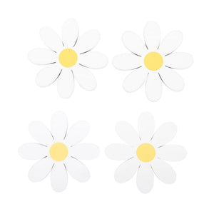 Top-down view of four daisy-shaped coasters with yellow centres on a white background.
