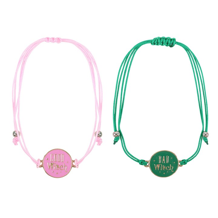 Pink Good Witch bracelet and green Bad Witch bracelet laid flat.
