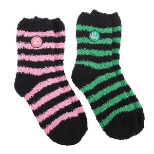 Cosy striped Good Witch and Bad Witch socks – pink and green fluffy pairs.