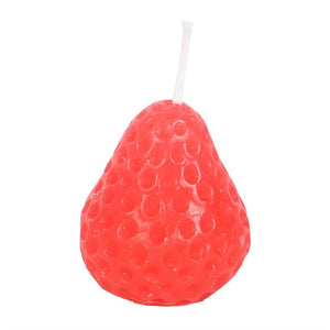 Close-up of a single strawberry-shaped candle showing realistic texture and vibrant colour, isolated on a white background.