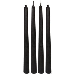 Set of four black gothic taper candles with pointed wicks, unlit and standing upright on a white background.
