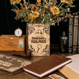 Sherlock Holmes Large Book Vase displayed among vintage books and flowers.