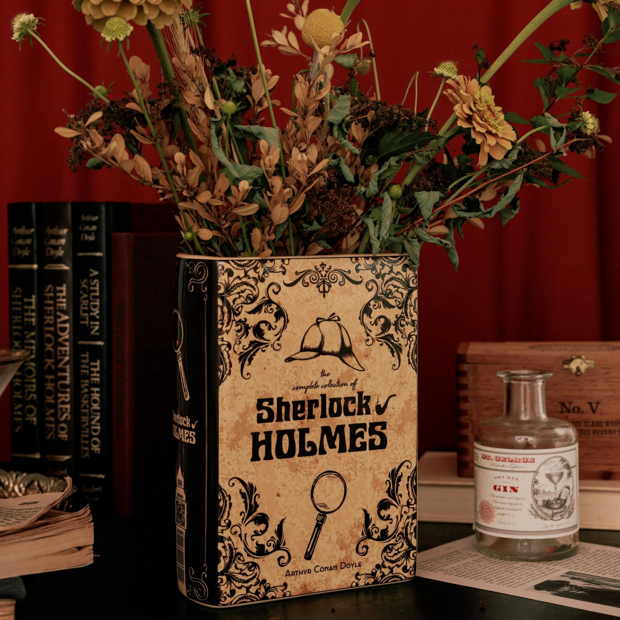 Sherlock Holmes Large Book Vase styled with flowers on a vintage desk.