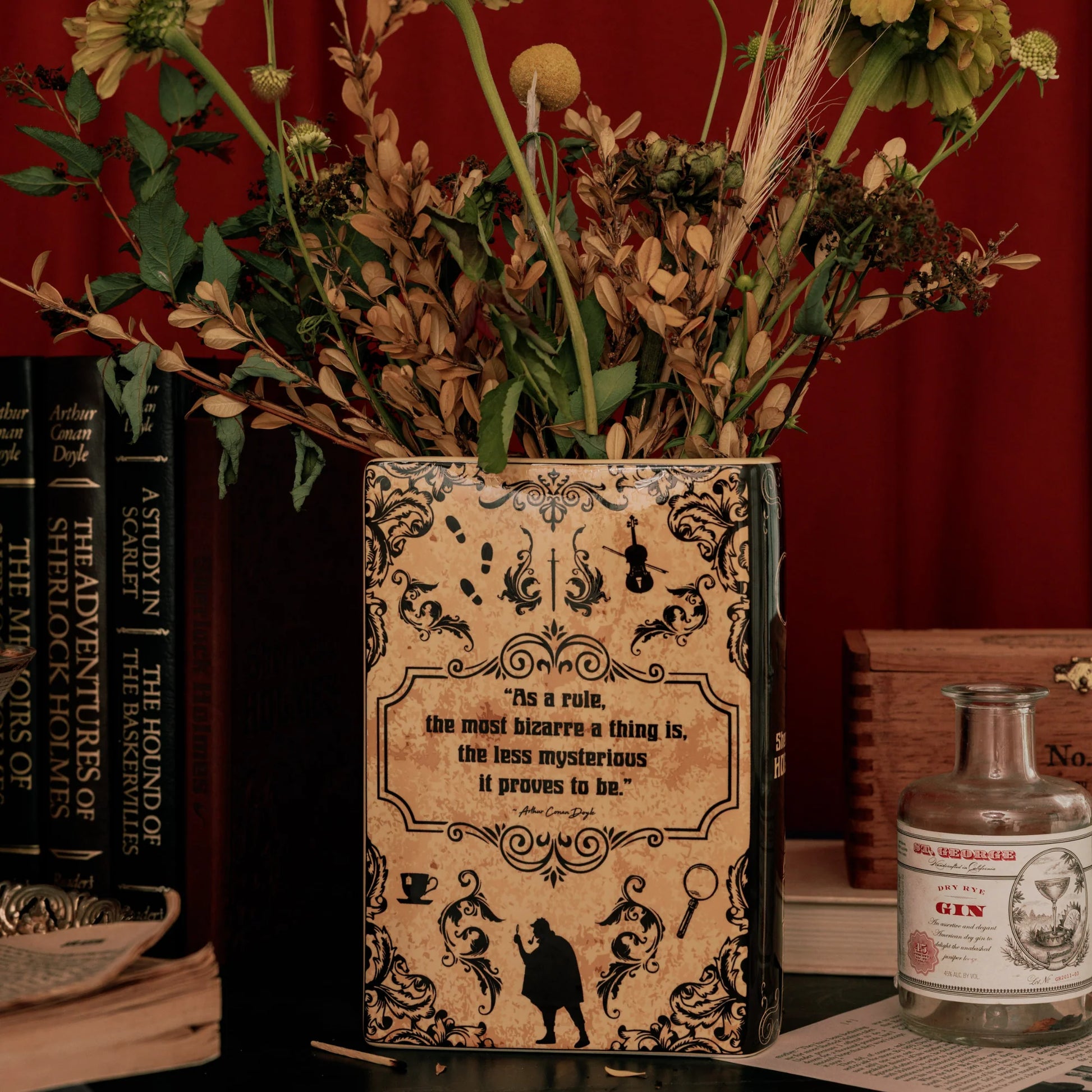 Back of Sherlock Holmes Book Vase with floral arrangement and classic décor.