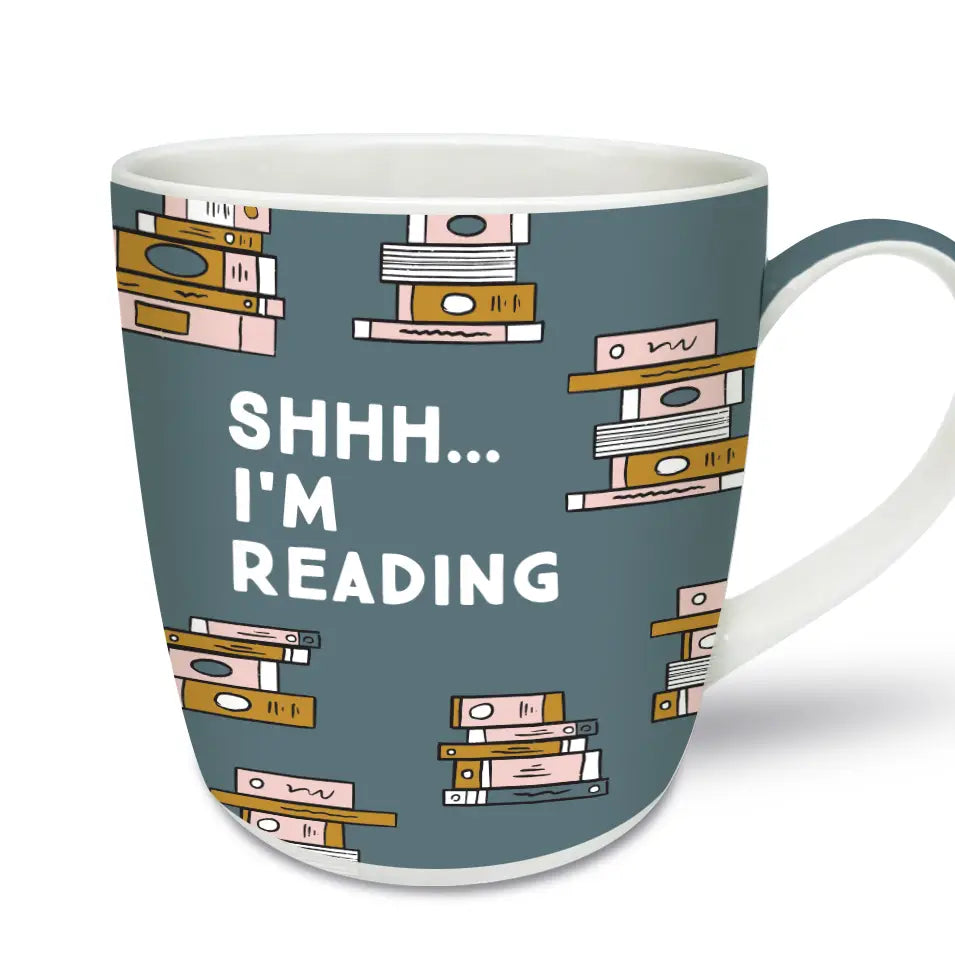 Shhh… I’m Reading Mug Front View – A stylish New Bone China mug featuring a playful “Shhh… I’m Reading” message with a stacked book design.