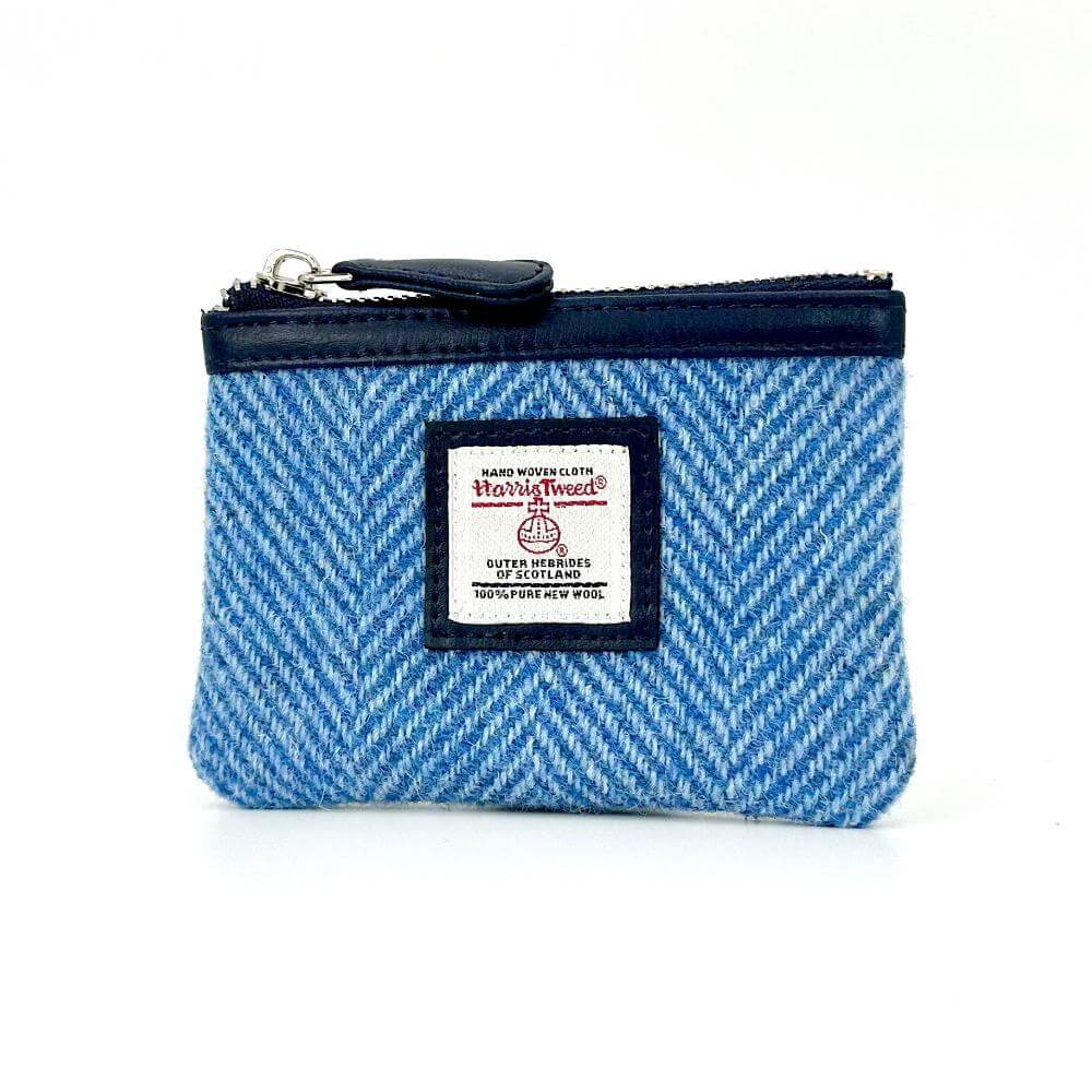 Angled front shot of Harris Tweed sky blue herringbone coin purse.