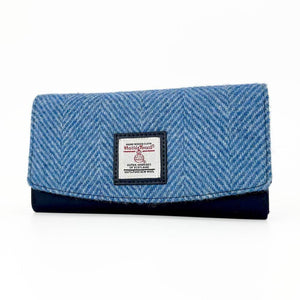 Sky Blue Harris Tweed envelope purse showing herringbone texture and soft curved edge.