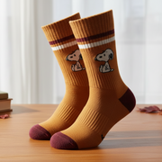 Snoopy Athletic Socks in mustard with maroon trim on wooden surface