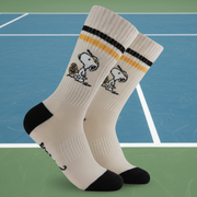 Tennis Snoopy Socks in cream with black trim on tennis court background