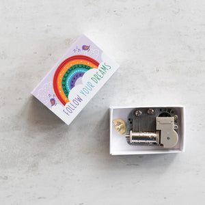 Somewhere Over the Rainbow matchbox gift with an open view of the miniature music box inside.