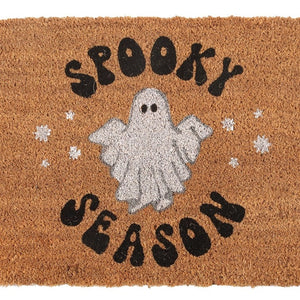 Close-up of glitter ghost and black lettering on Halloween doormat.