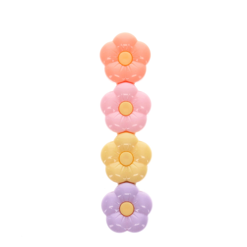 Stacked pastel flower-shaped highlighters in pink, yellow and purple.