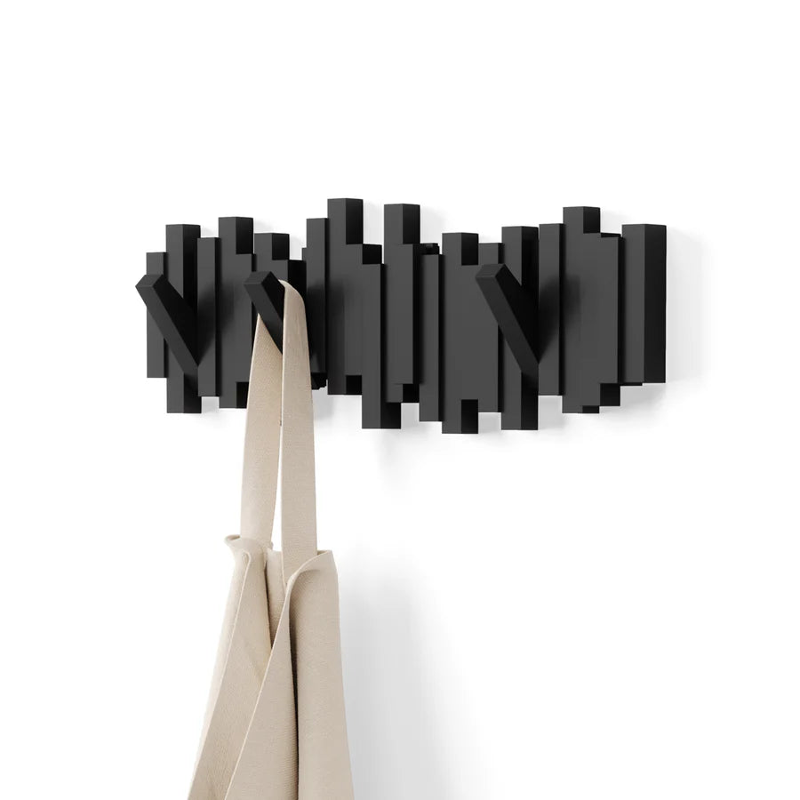 Sticks 5 wall hook black product shot with eucalyptus branch styling