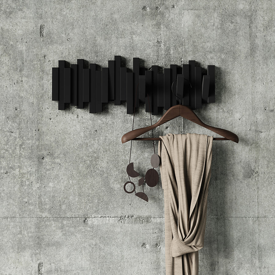Sticks 5 hook black showing staggered sculptural design on grey wall