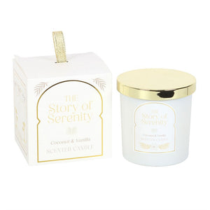 Coconut & Vanilla scented candle from The Story of Serenity range, frosted white jar with gold lid and matching white gift box with gold detail.