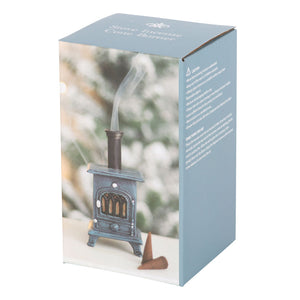 Boxed incense burner with product and cones – stove incense cone holder next to its packaging and brown incense cones.