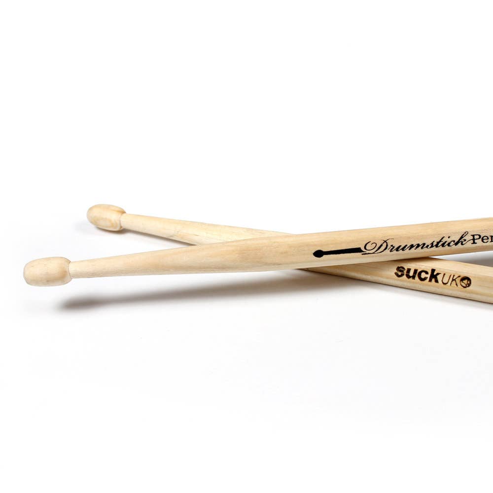 Detailed close-up of the rounded drumstick ends on Suck UK pens, emphasising the smooth wood grain and craftsmanship.