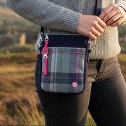 Drem Tweed Phone Crossbody Pouch in navy plaid worn crossbody style