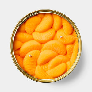 Closed CandleCan tin labelled “Peeled Tangerines” with illustrated fruit segments on the lid, designed to mimic gourmet canned food packaging.