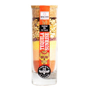 Tequila Sunrise cocktail mix in a tall glass bottle with colourful layers of citrus, sugar and berries.