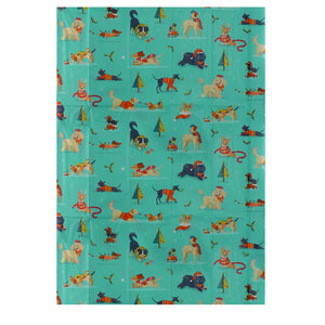 Unfolded Festive Friends tissue paper showing colourful dog and Christmas tree pattern – ideal for wrapping or crafts.