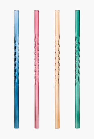 Set of four coloured twist glass straws on white background.