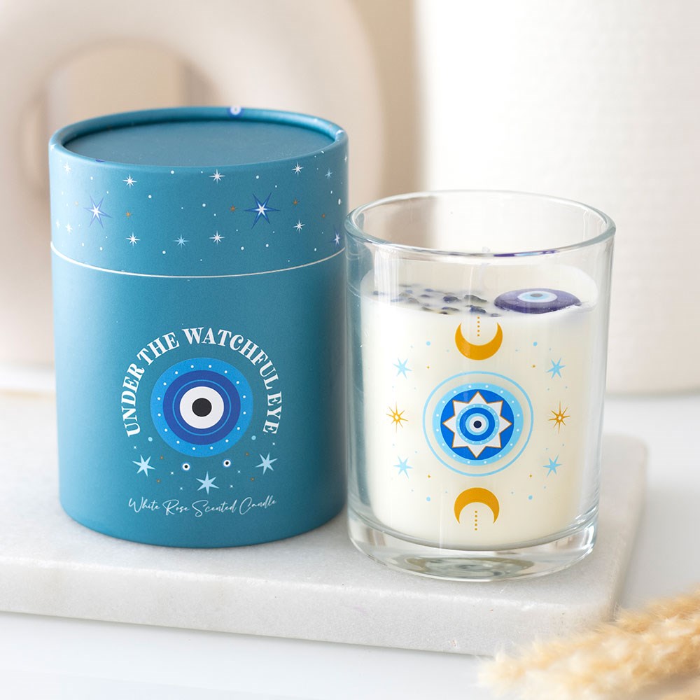 Under the Watchful Eye White Rose Candle with Crystals in turquoise gift box and matching celestial glass jar design.
