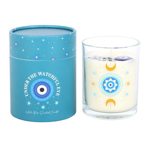 White rose scented candle with crystal chips and all-seeing eye design beside turquoise gift box.