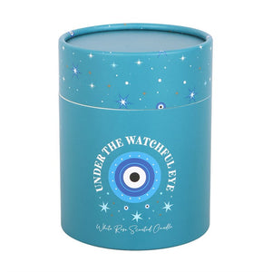 Turquoise cylinder gift box with celestial star design and Under the Watchful Eye text.