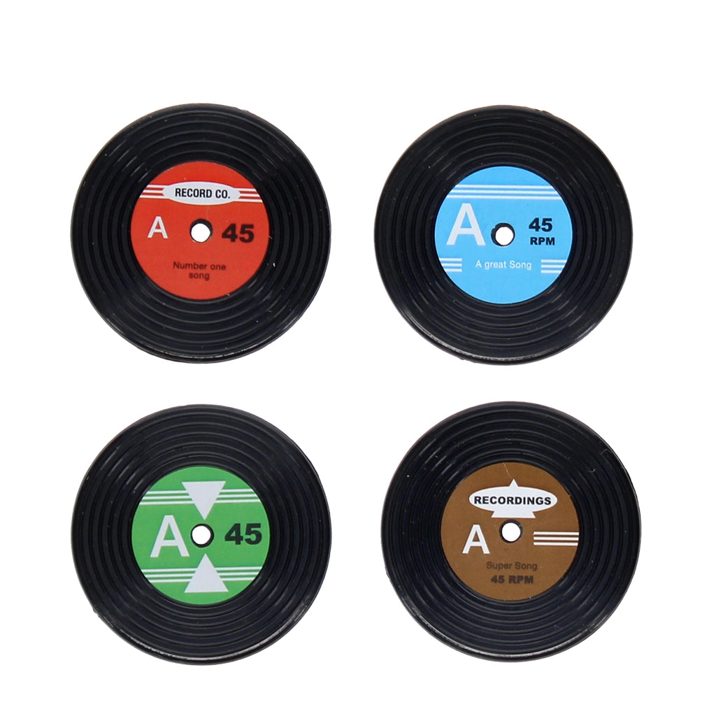 Top-down view of 4 vinyl record magnets featuring colourful A-side inspired labels in red, blue, green, and brown.