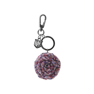 A charming violet mini dogtooth Harris Tweed rose keyring, adding a touch of whimsy to your keys.