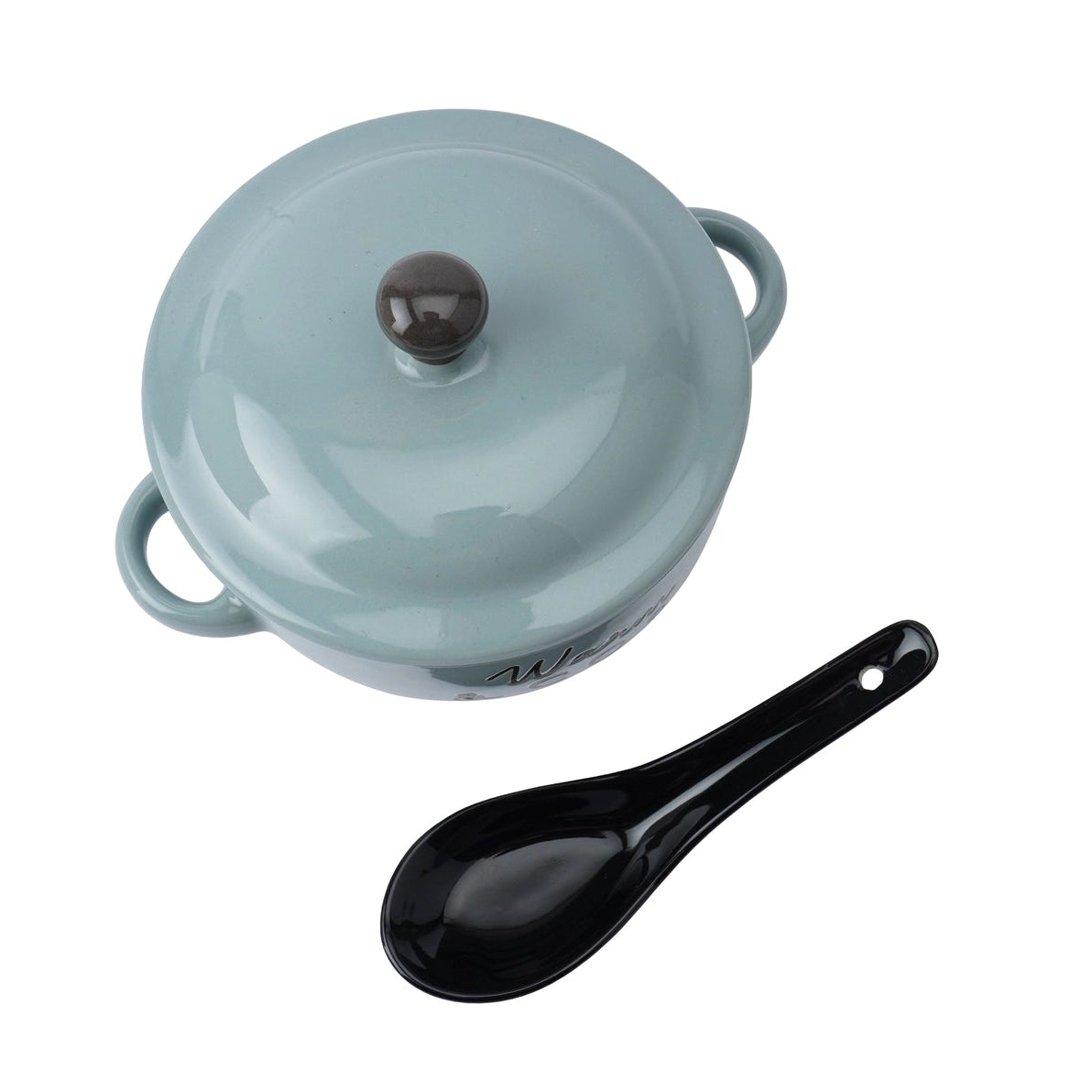 Warm and cosy soup bowl with tomato soup and swirl cream, styled in an autumn scene with leaves and pumpkins