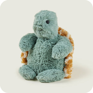 Warmies Baby Turtle side angle showing green plush body and patterned shell.
