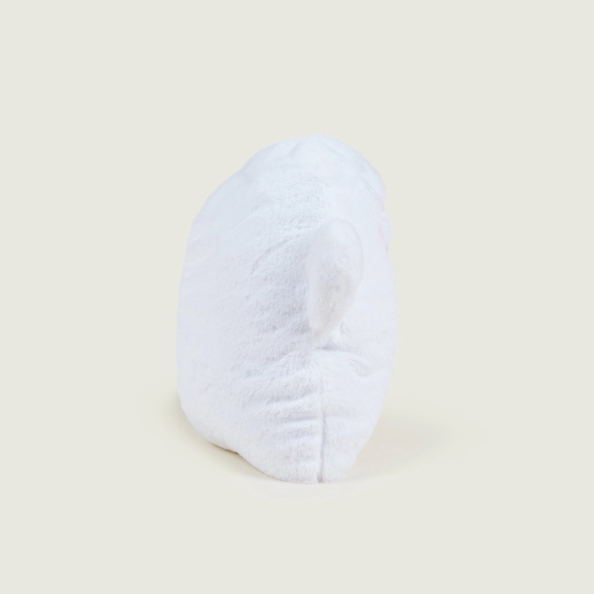 Angled side view of Warmies Ghost microwaveable plush toy.