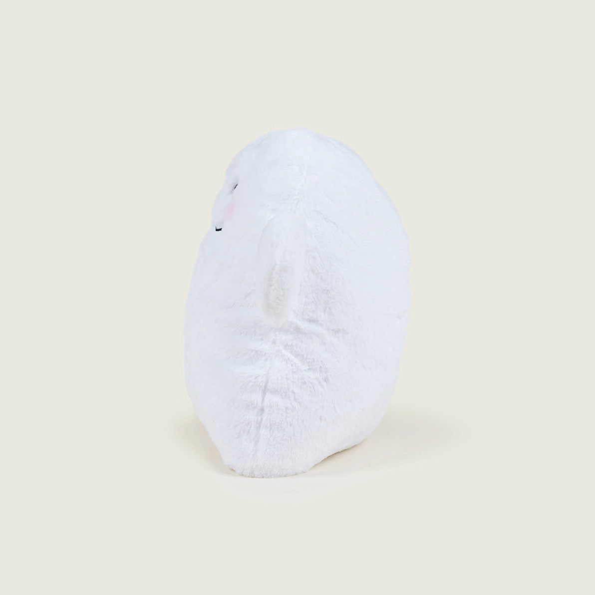 Side profile of Warmies Ghost soft toy highlighting its rounded shape.