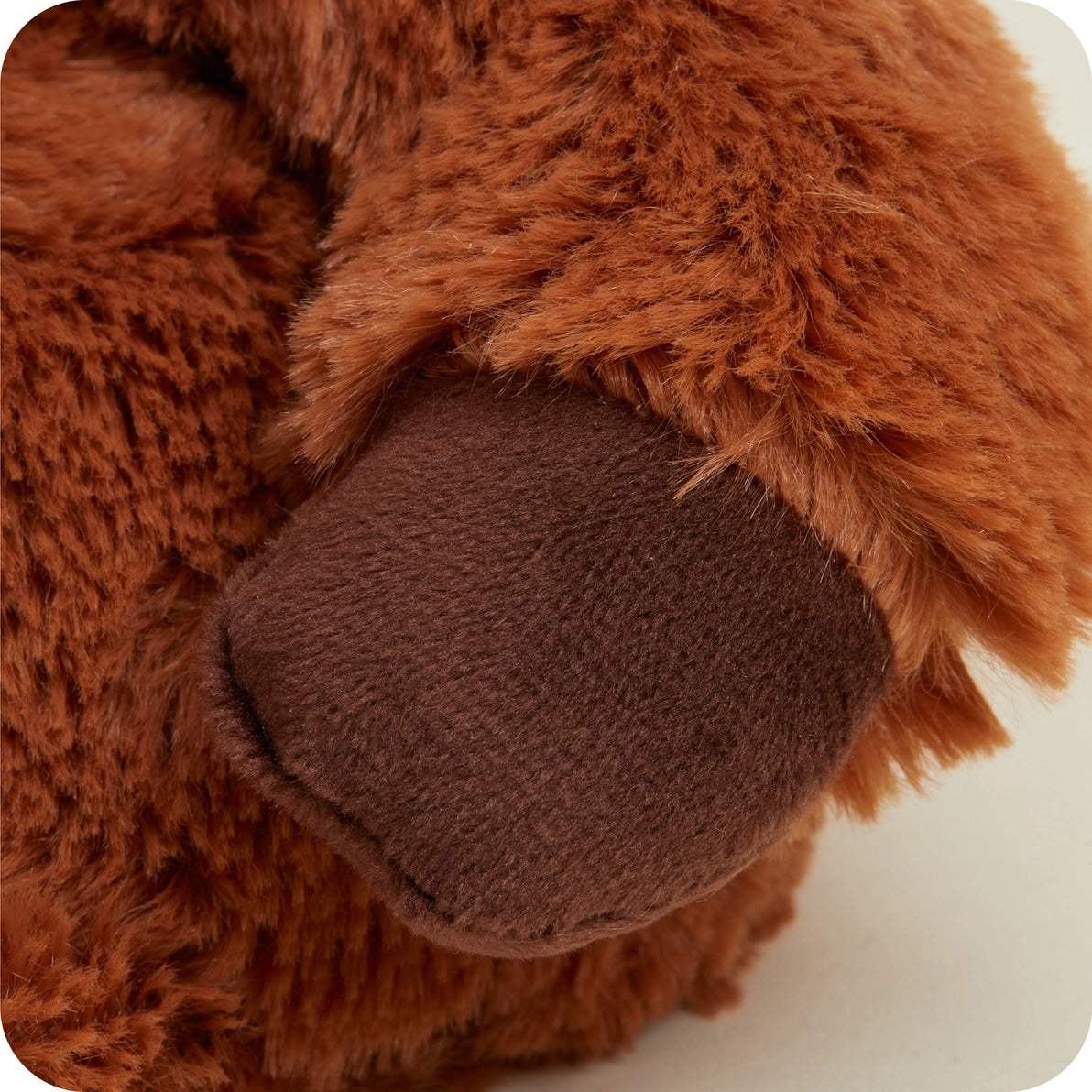 Soft brown fur texture of Warmies Junior Highland Cow plush.