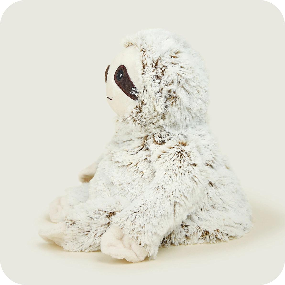 Profile view of Warmies Marshmallow Sloth microwavable soft toy with long arms and cosy design.