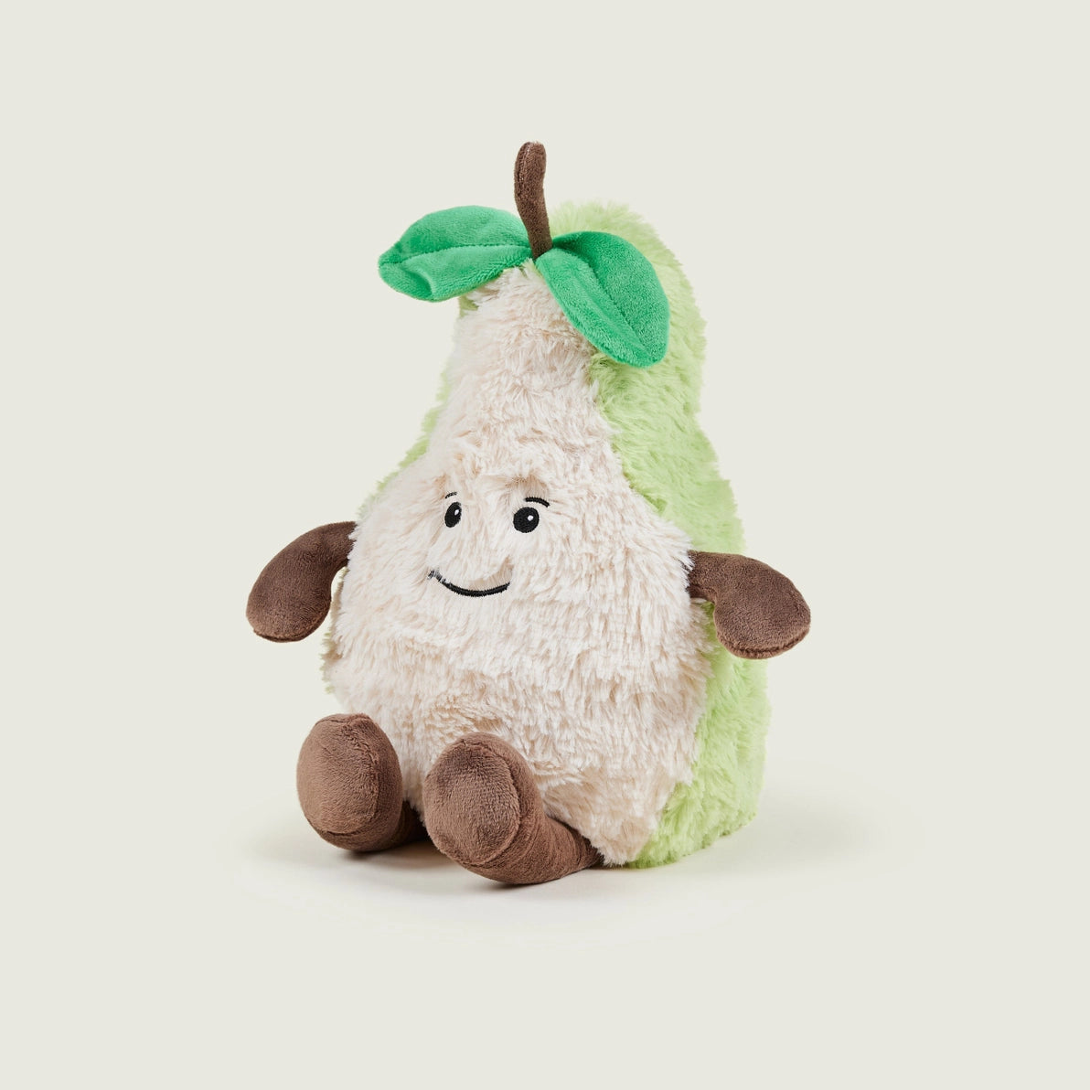 Warmies Pear cuddly toy side view with green leaf detail.