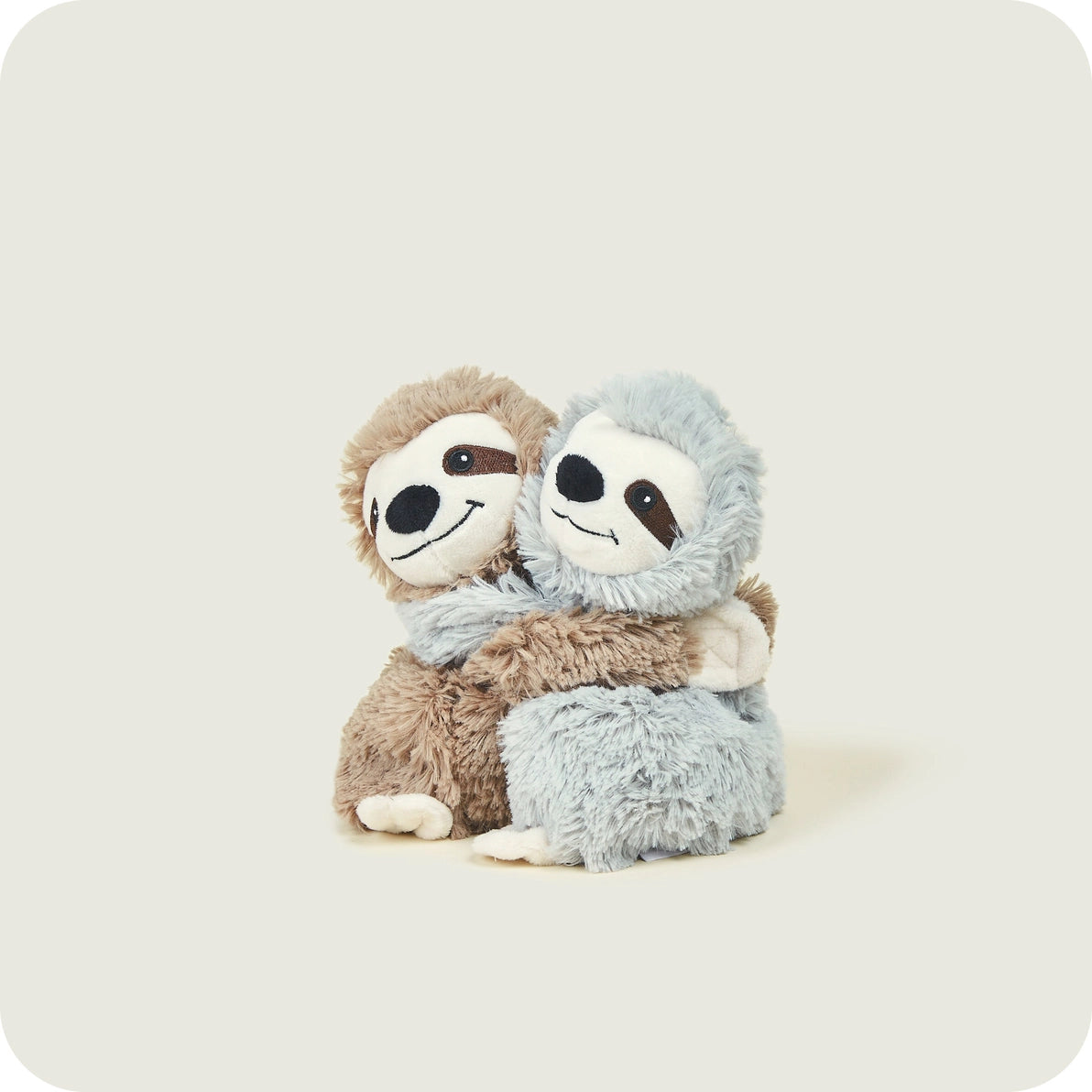Brown and grey Warmies Warm Hugs Sloths cuddling plush toys on white background.
