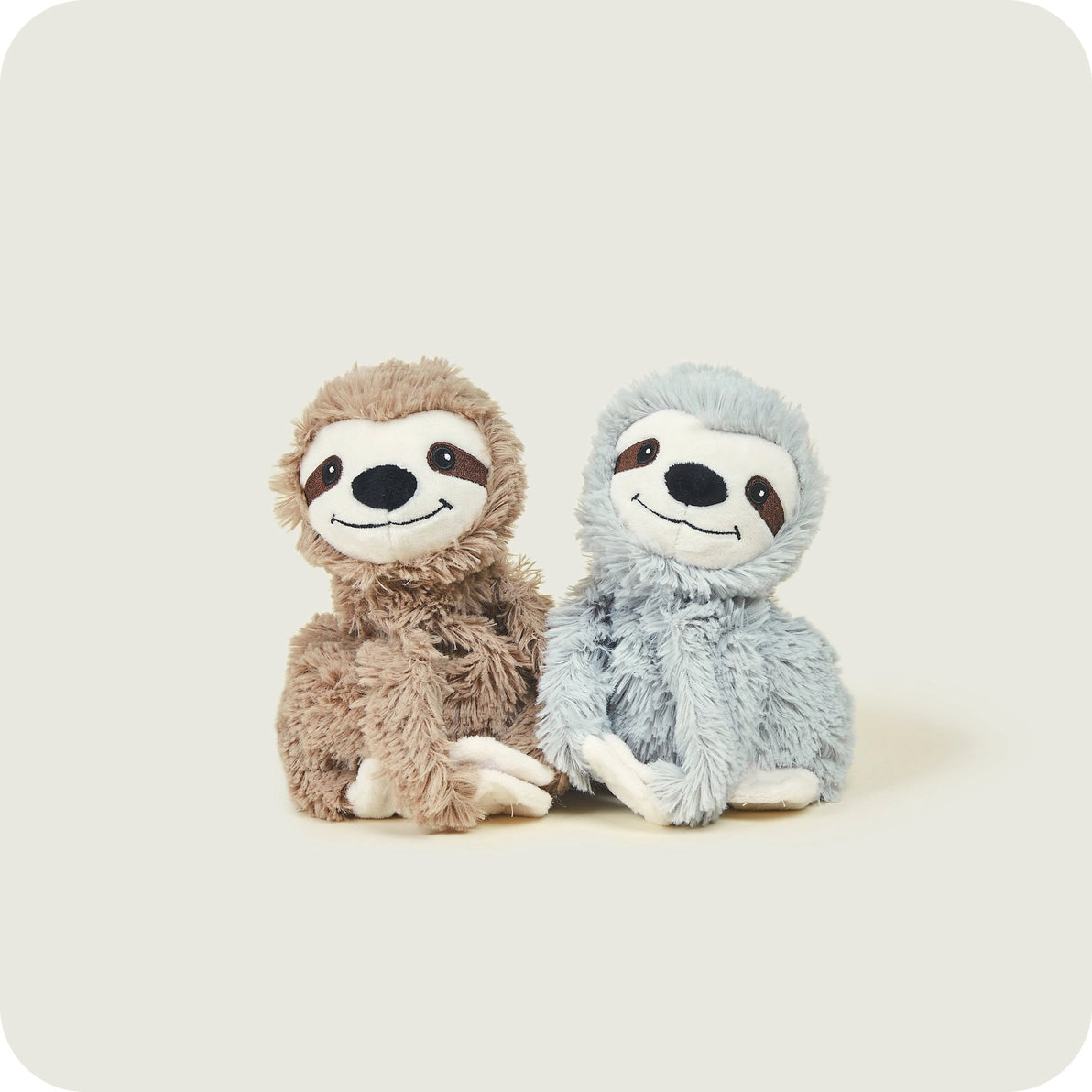 Warmies Warm Hugs Sloths plush toys sitting side by side, heatable and scented.